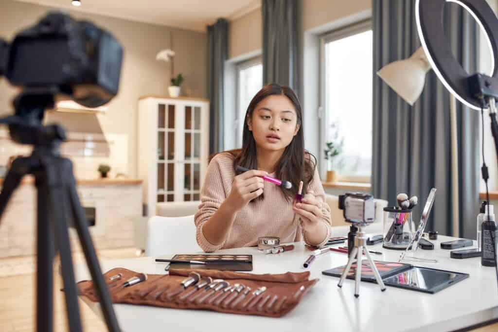beauty blogger sharing makeup in front of camera