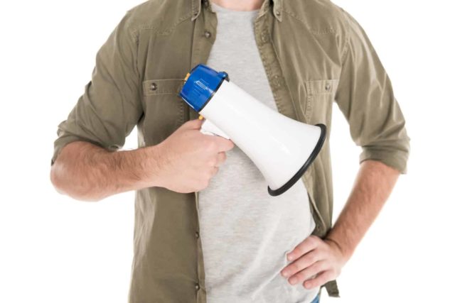 man holding megaphone to advertise for companies