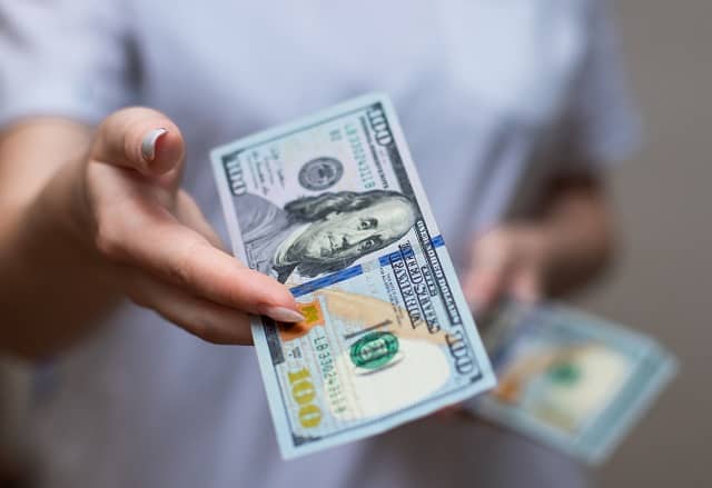 Person holding money