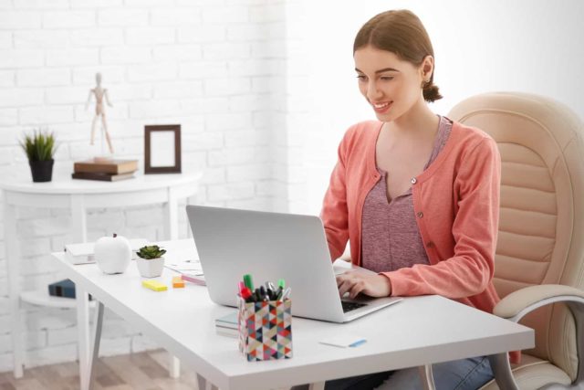 woman proofreading online on a laptop