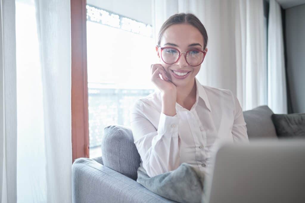 Young woman working on a laptop from home